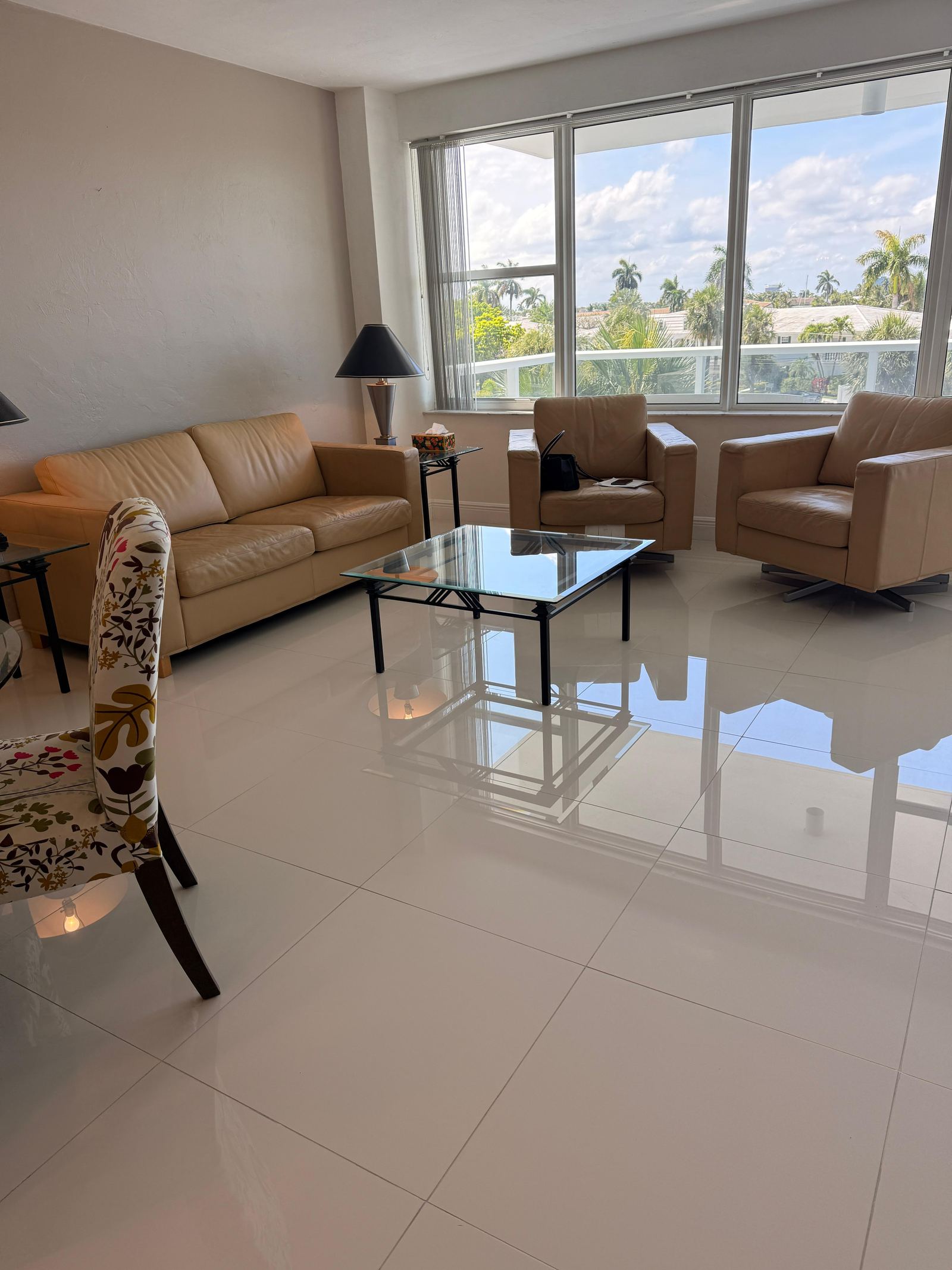Bright living room with polished tile floors after cleaning